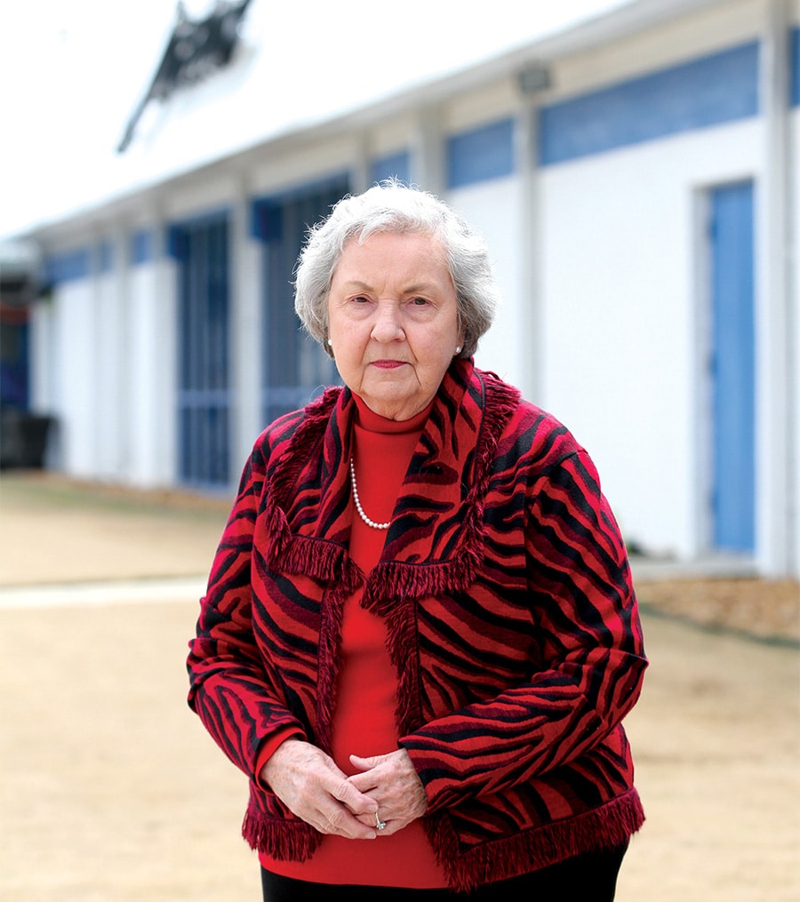 Dot Lane poses for a photo outside Koch Foods of Gadsden.