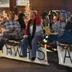 Students and staff wave from the Pathways Academy float during the City of Gadsden Christmas parade.