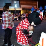 Minnie Mouse hugs a young girl during the Attalla Christmas parade.