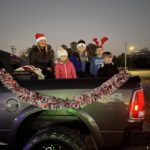City of Southside Mayor Dana Snyder rides in the back of a pickup truck during the Southside Christmas parade.