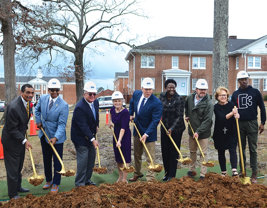 City officials and Gadsden State administrators hoist golden shovels at the ceremonial groundbreaking for Gadsden State's Advanced Manufacturing Center.