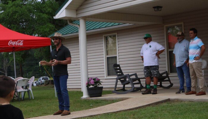 Owner Drake White addressing the crowd.