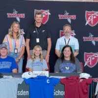 Gracey Lankford (middle) pictured with her dad, Jeremy (seated left), mom, Rebecca (seated right), girls' athletic director, Amanda Lewis (top left), head golf coach, Steve Brown (top middle), and prinicpal, Joel Gulledge (top right) at her signing ceremony on Monday.